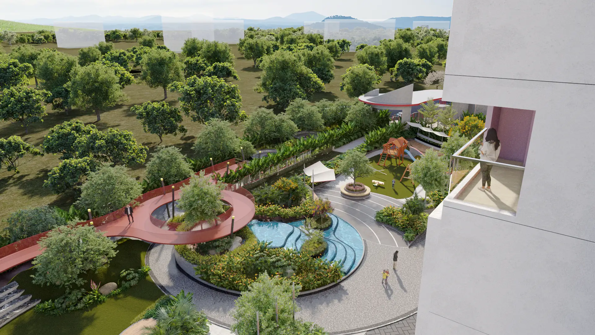 Elevated view from an apartment balcony over the landscaped grounds — the red skywalk bridge, free-form pool, children's play area and the tree canopy beyond