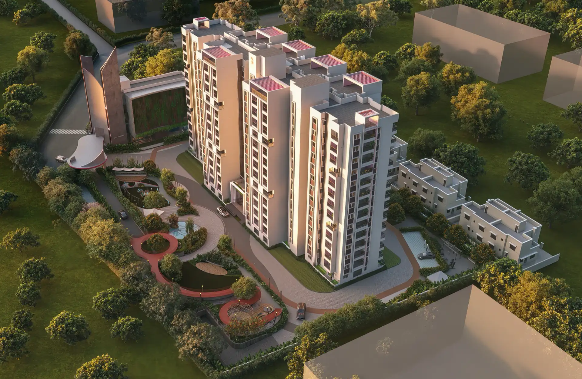 Golden-hour aerial of the enclave, showing the apartment towers, the landscaped central park with its play courts and seating circles, and the sculpted entrance gateway