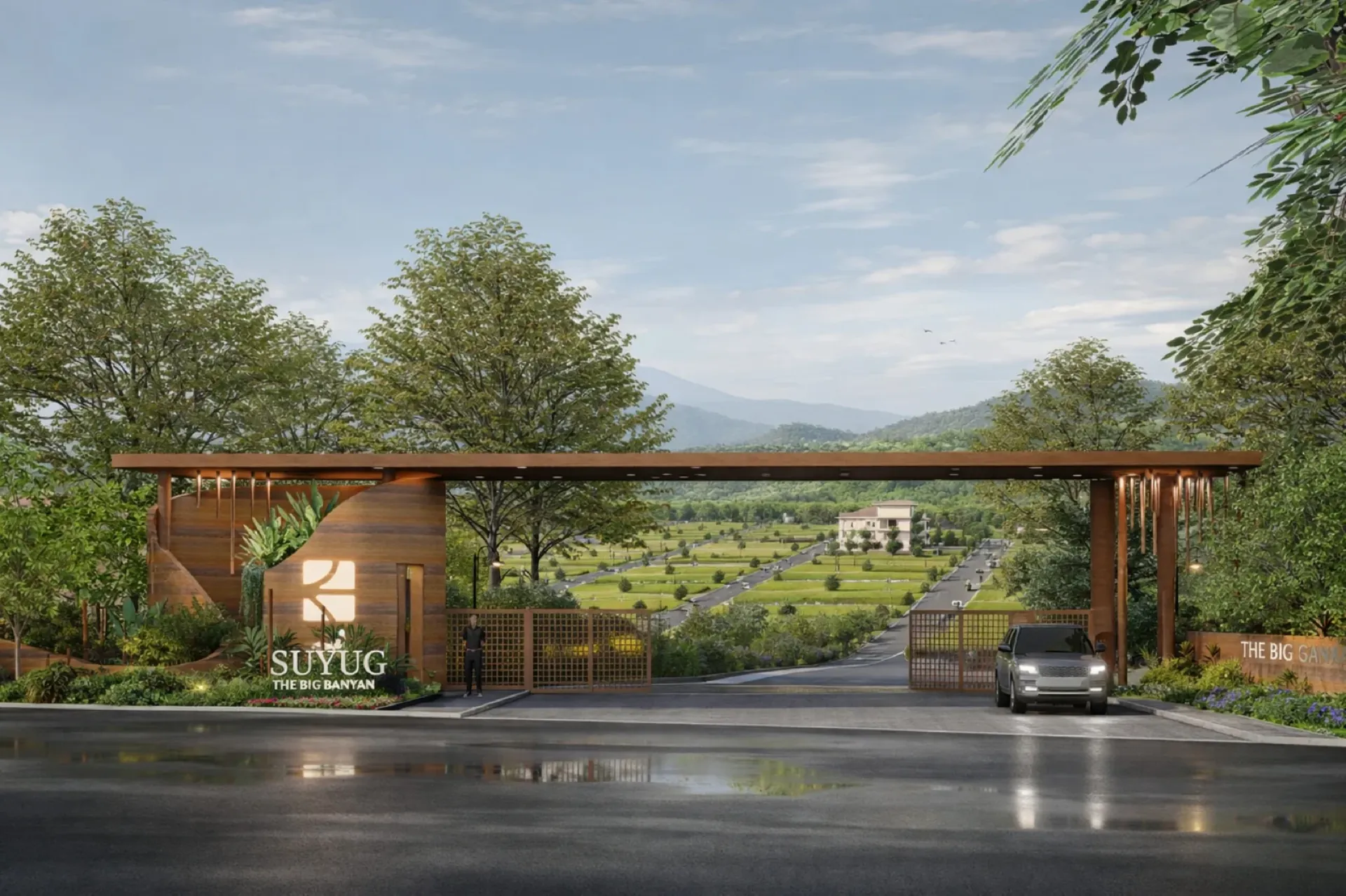 Architectural render of the entrance gateway: SUYUG The Big Banyan signage on a timber gate wall, plotted greens and hills beyond the gates.