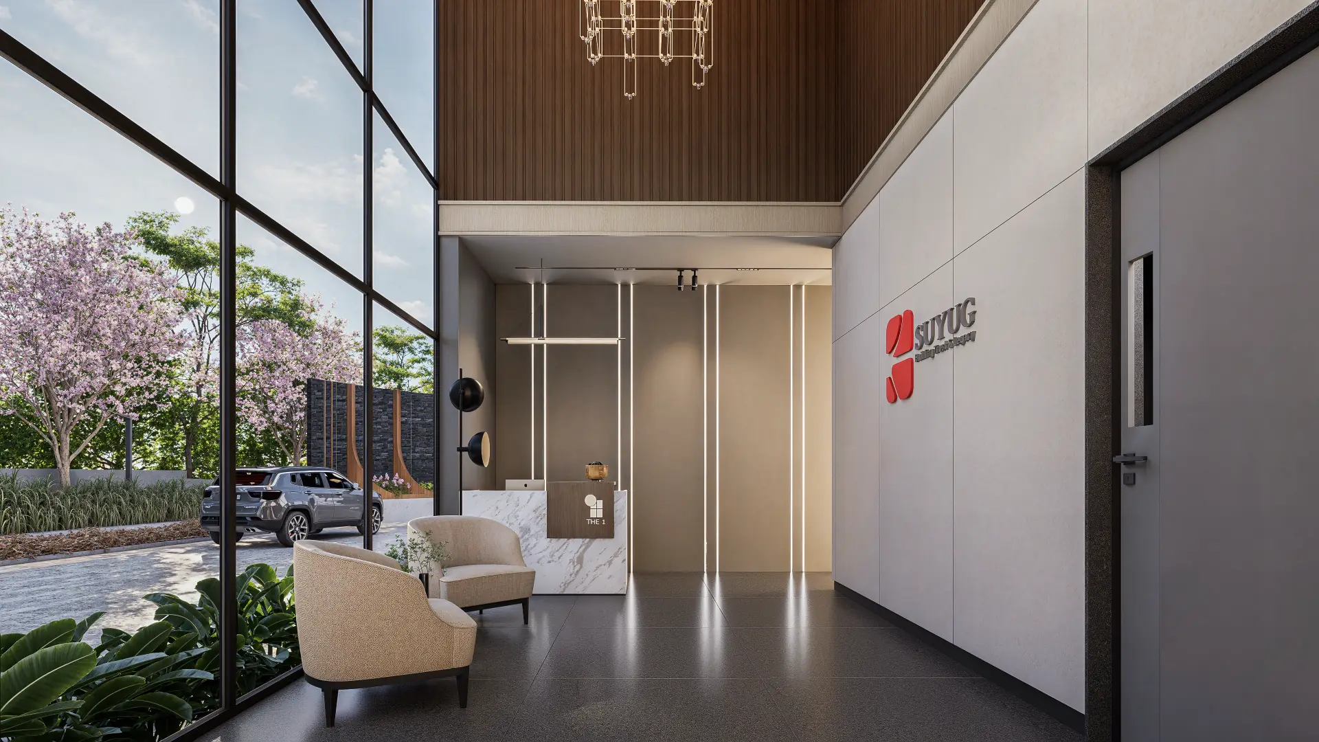 Double-height entrance lobby with full-height glazing onto a blossom-lined driveway, reception desk, lounge chairs and a linear chandelier