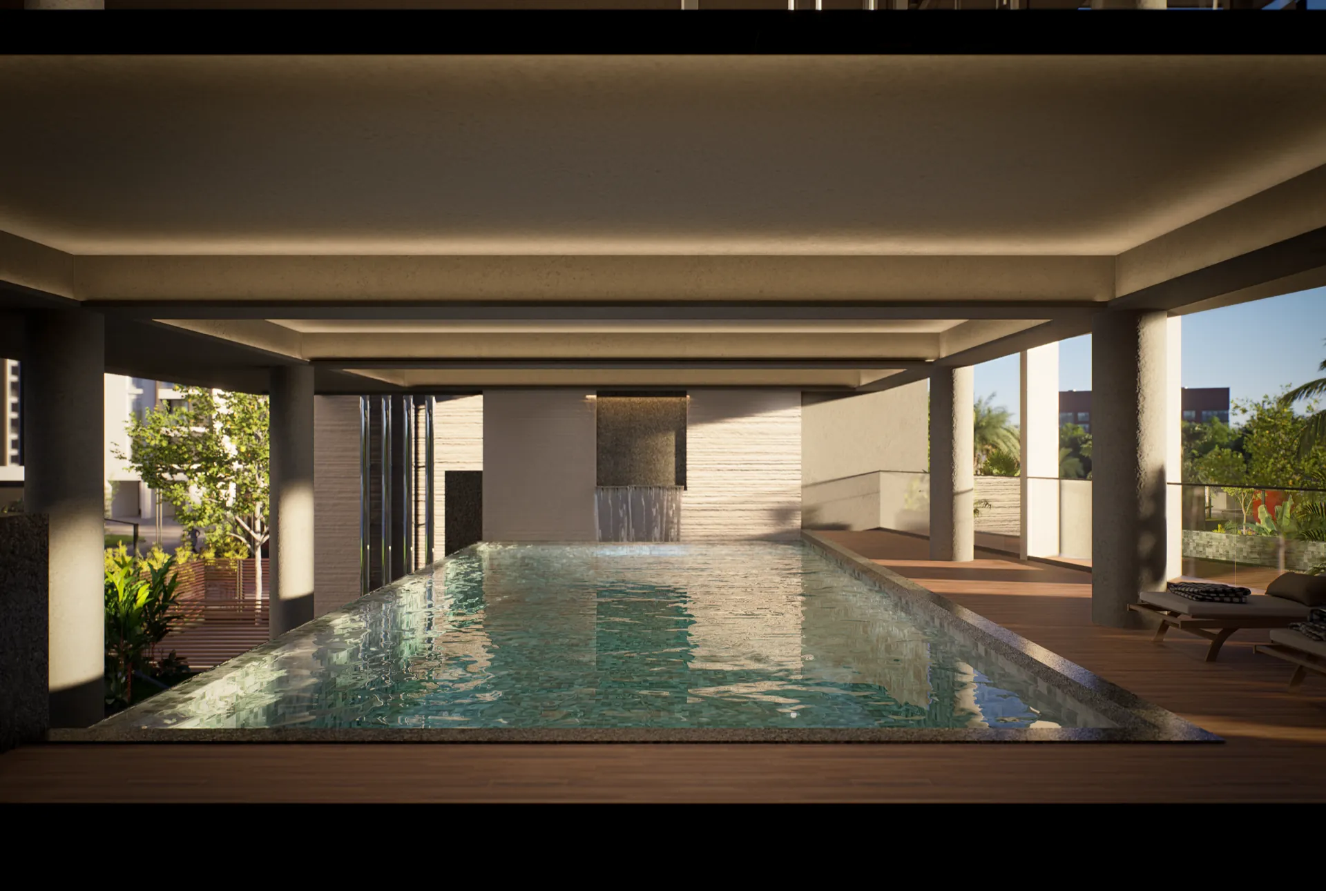 Covered lap pool set under a colonnaded deck, with a stone water-feature wall spilling into the water
